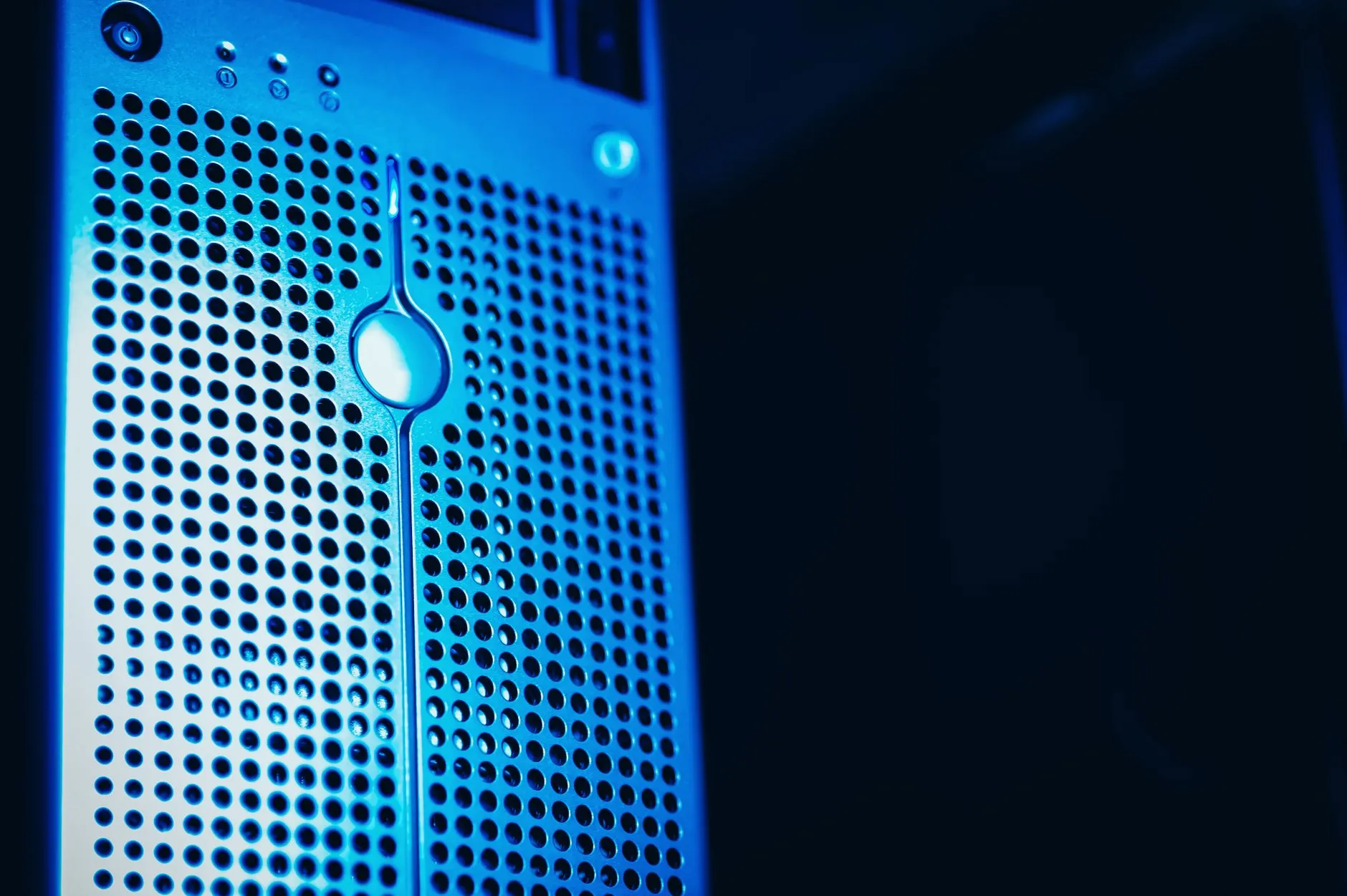 Close-up of a server unit lit by blue data center lighting