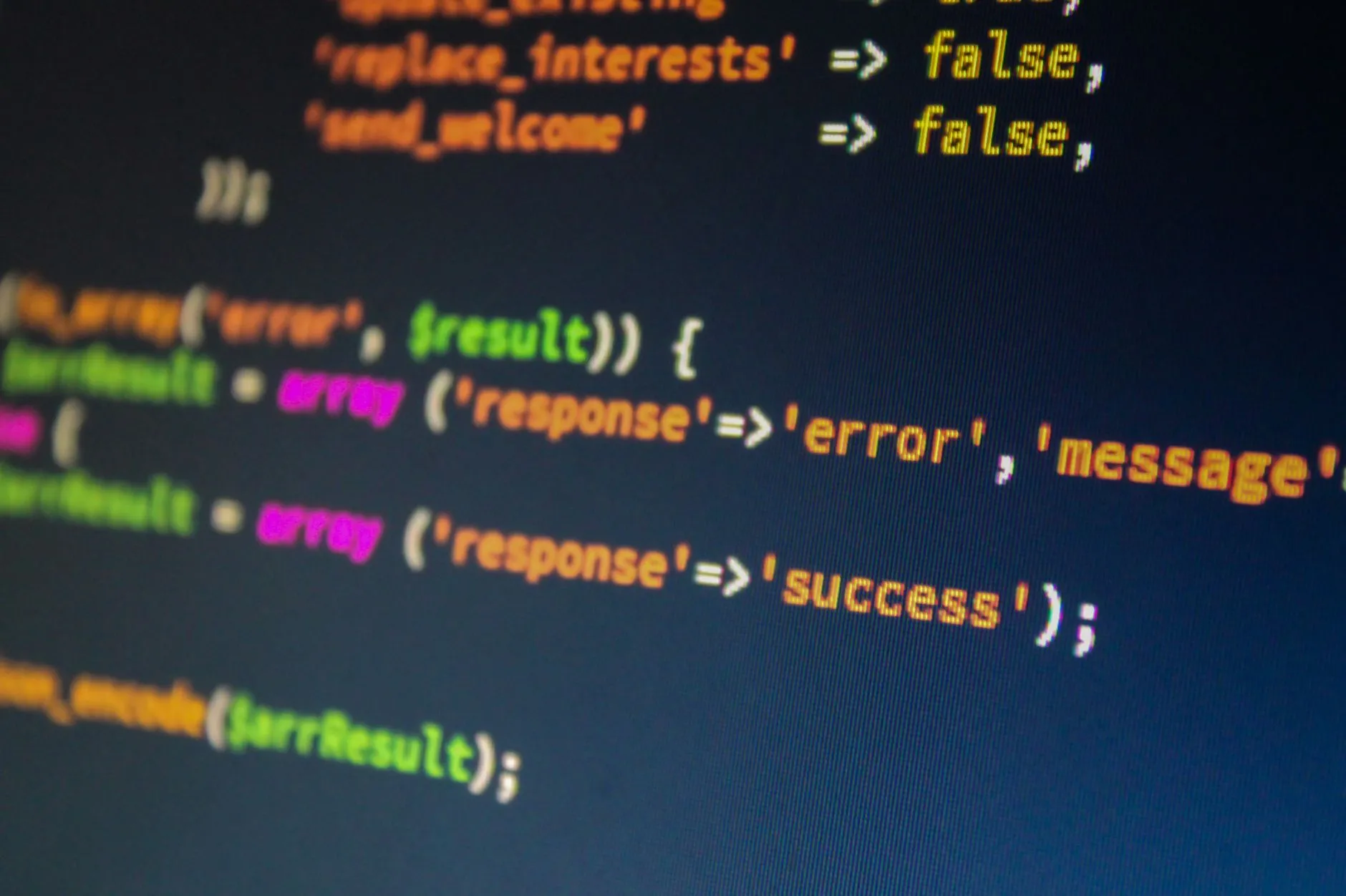 Close-up of code handling an error and success response on screen