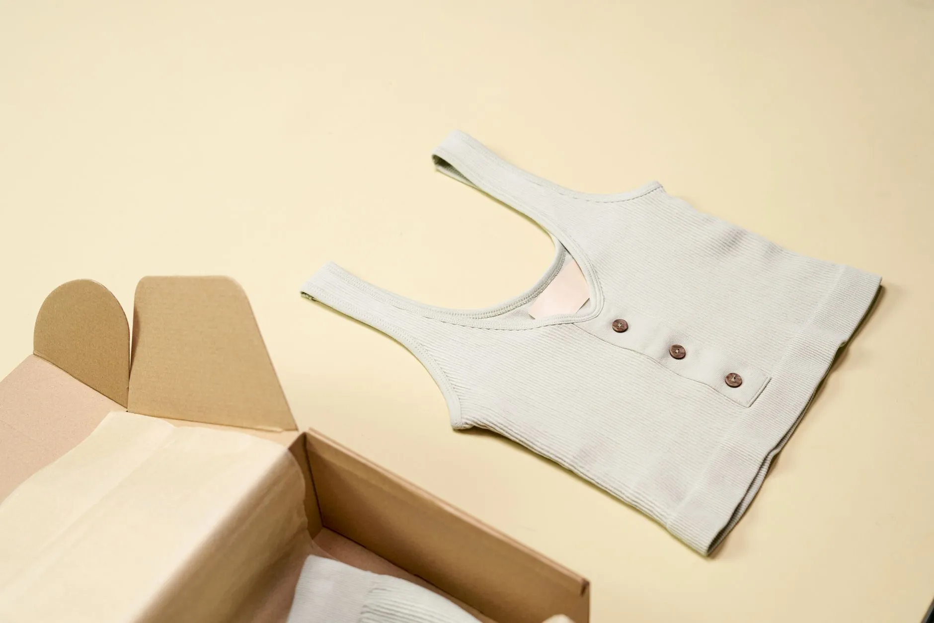 Product packaging and clothing laid out for online store photography