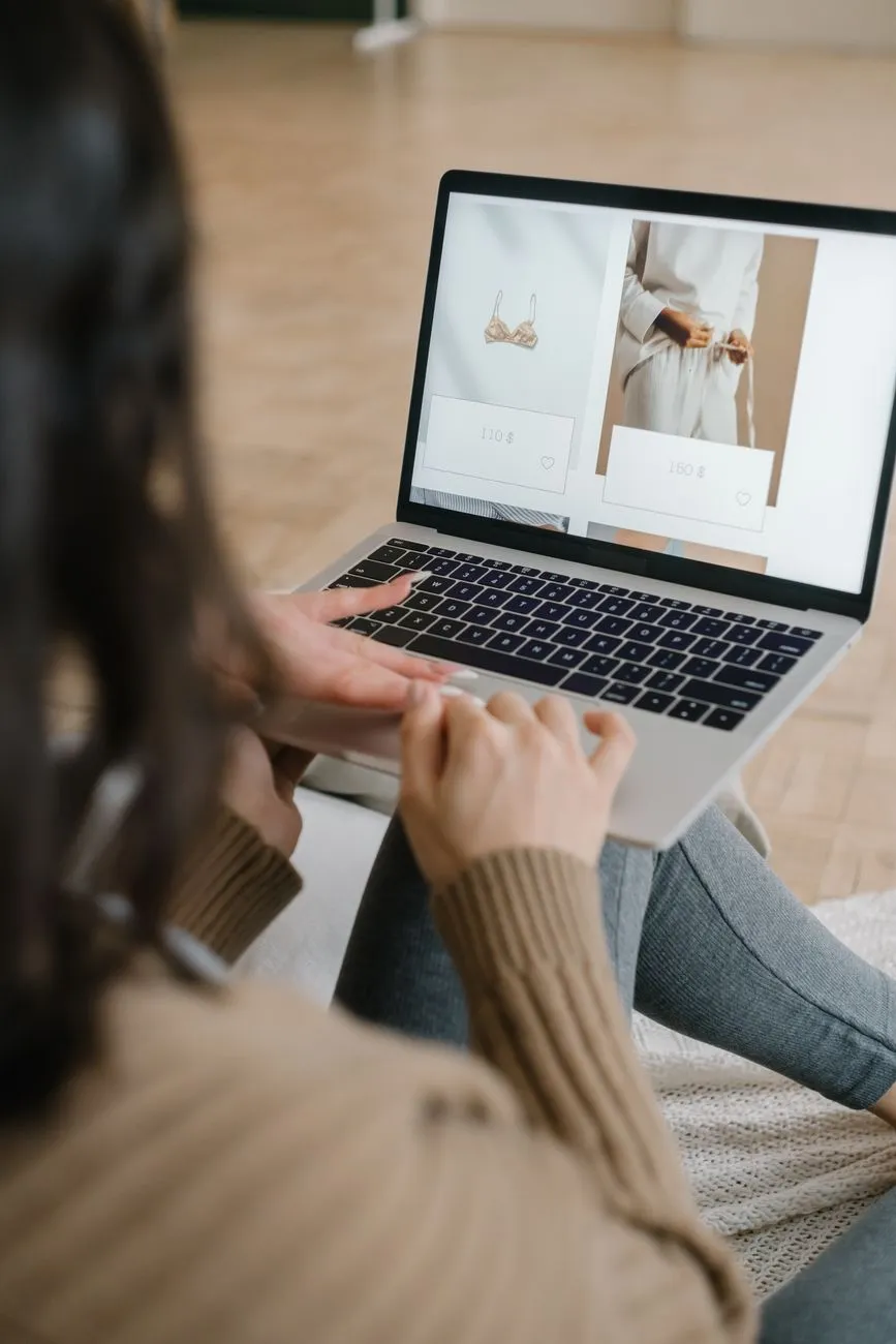 Shopper browsing product listings on a laptop